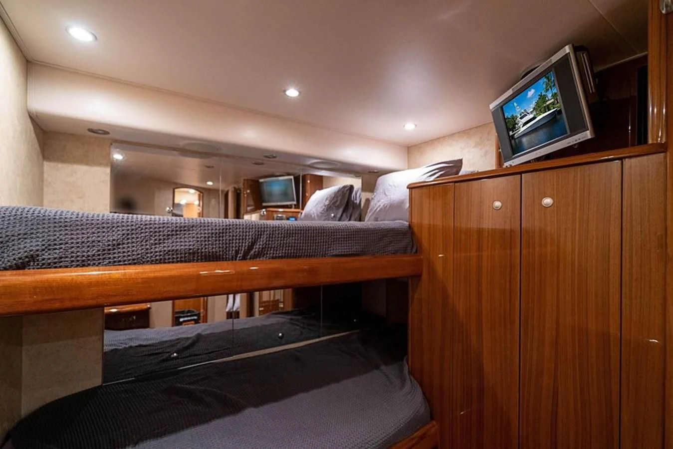 a bed with a television on top of it aboard KNOT RACING Yacht for Sale