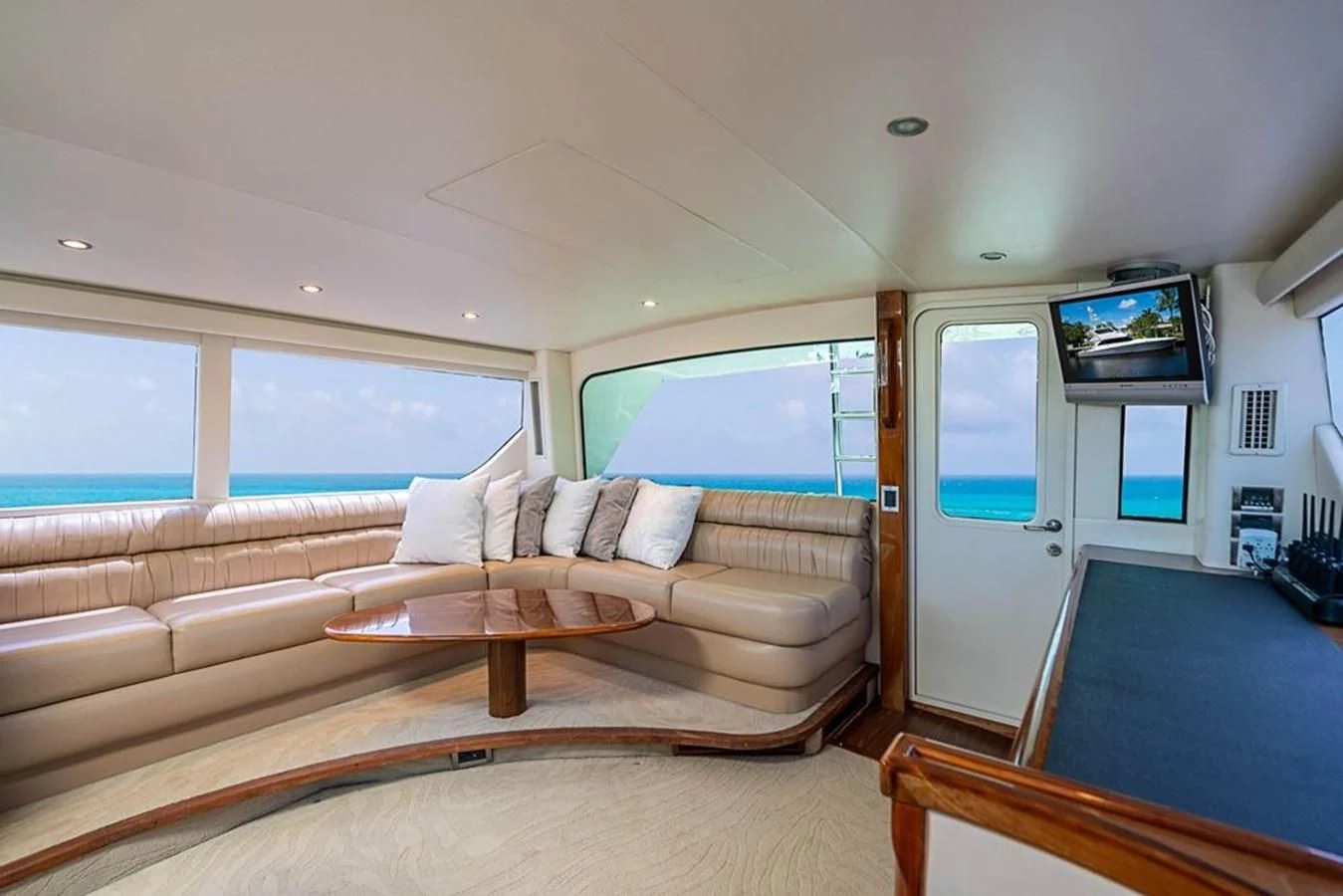 a living room with a couch and a television aboard KNOT RACING Yacht for Sale
