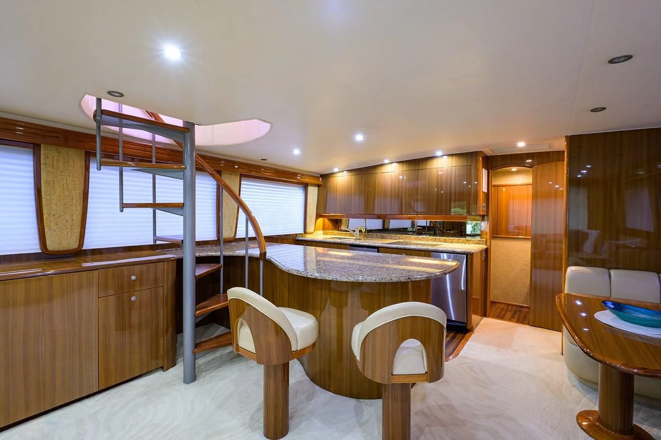a large kitchen with a table and chairs aboard KNOT RACING Yacht for Sale