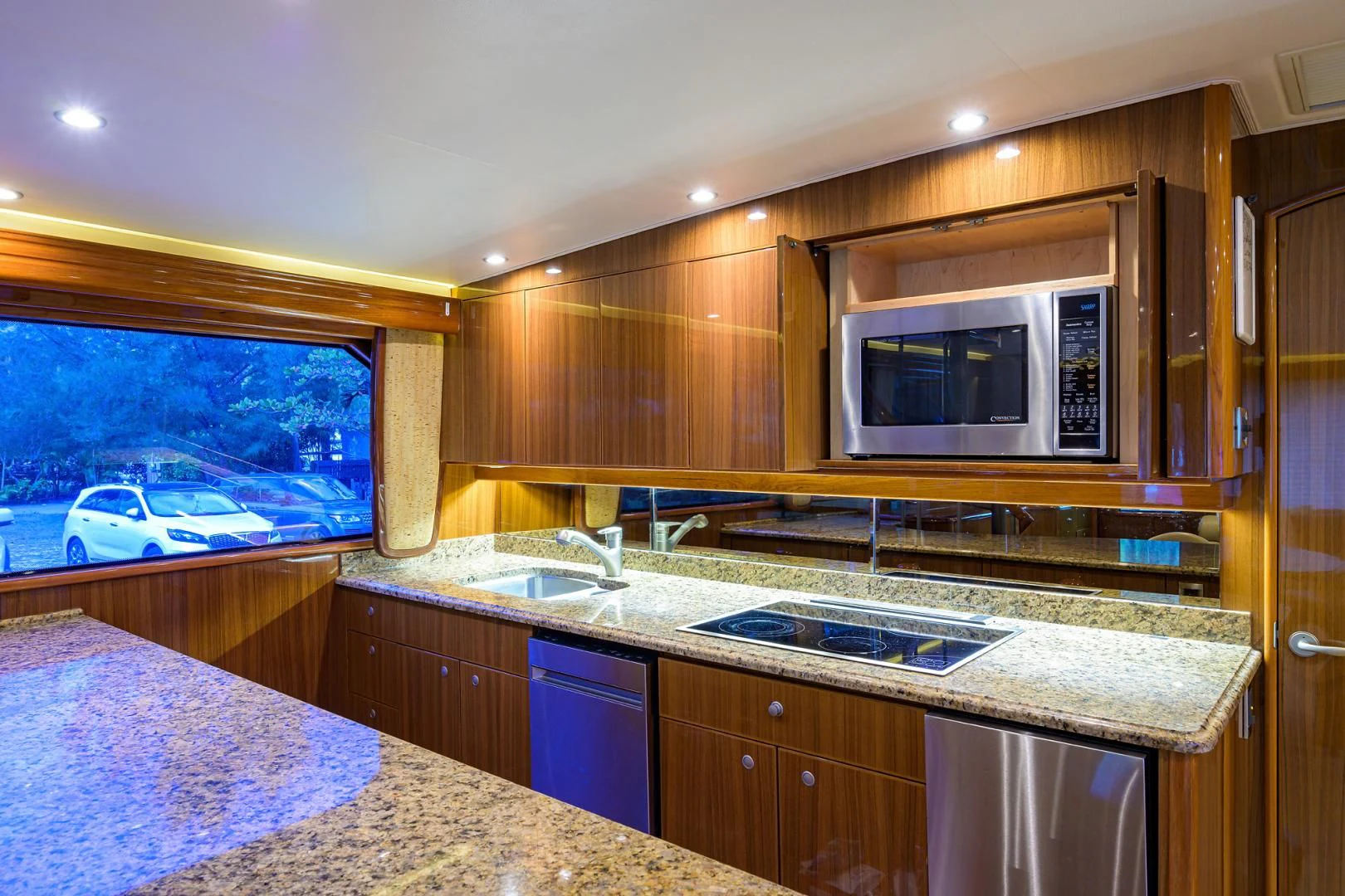 a kitchen with a microwave oven aboard KNOT RACING Yacht for Sale