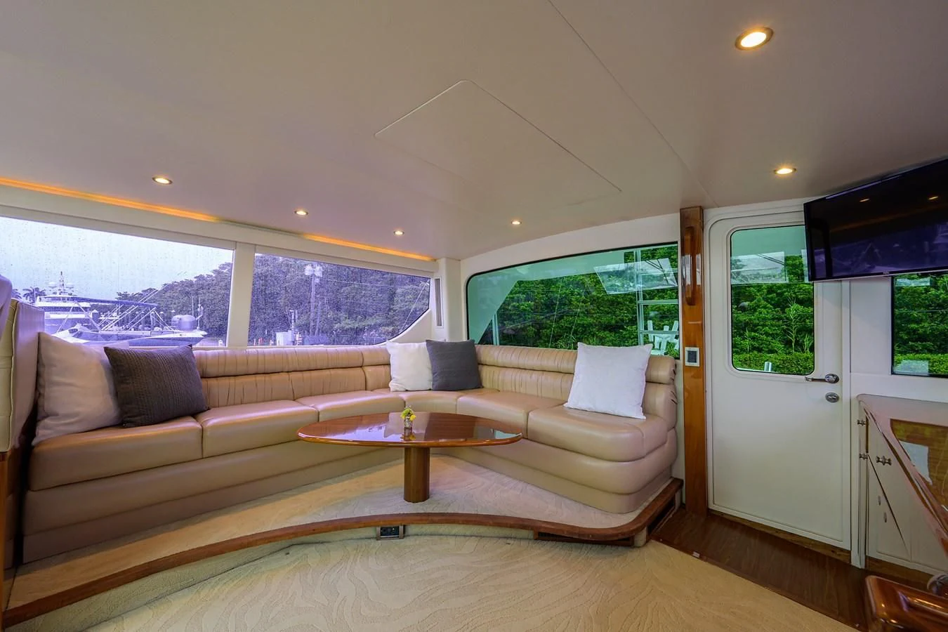 a living room with a couch and a table aboard KNOT RACING Yacht for Sale