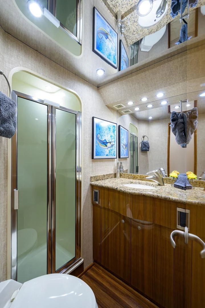 a bathroom with a large mirror aboard KNOT RACING Yacht for Sale