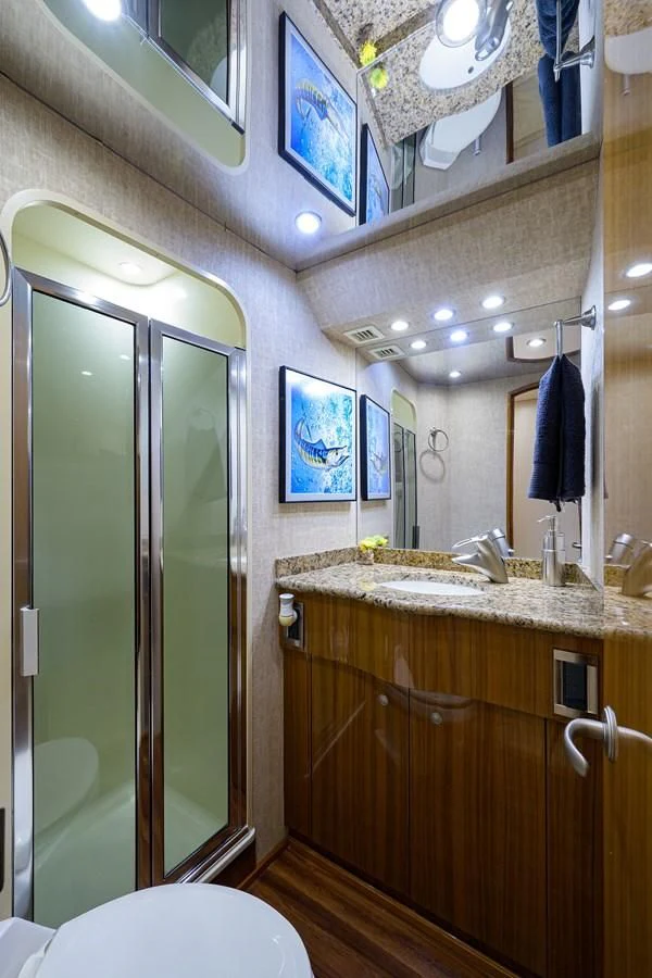 a bathroom with a sink and a mirror aboard KNOT RACING Yacht for Sale