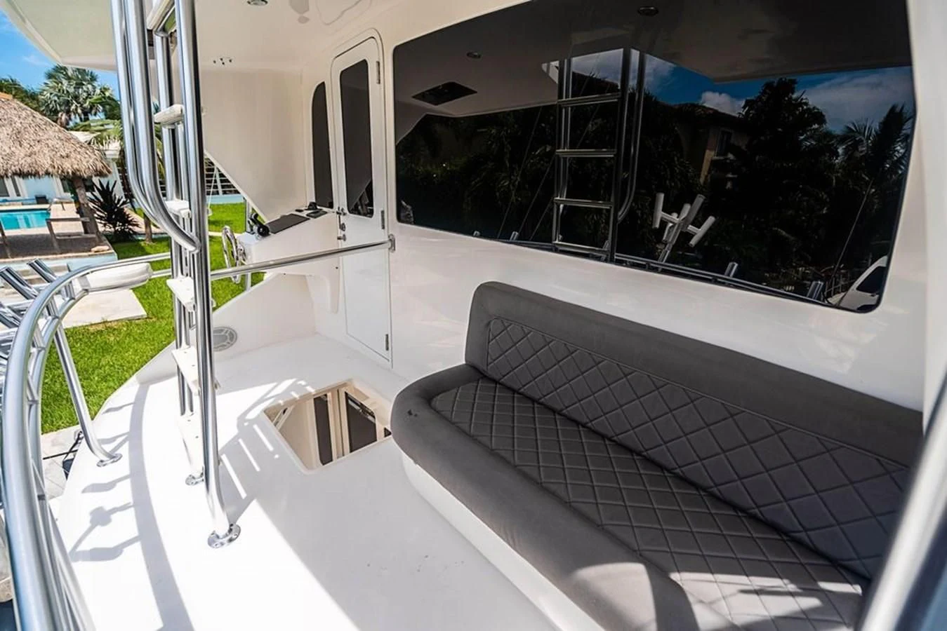 a white boat on a deck aboard KNOT RACING Yacht for Sale