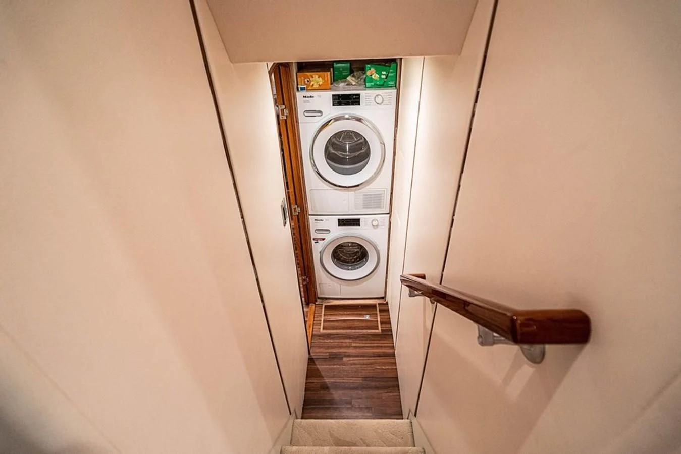 a washing machine in a room aboard KNOT RACING Yacht for Sale
