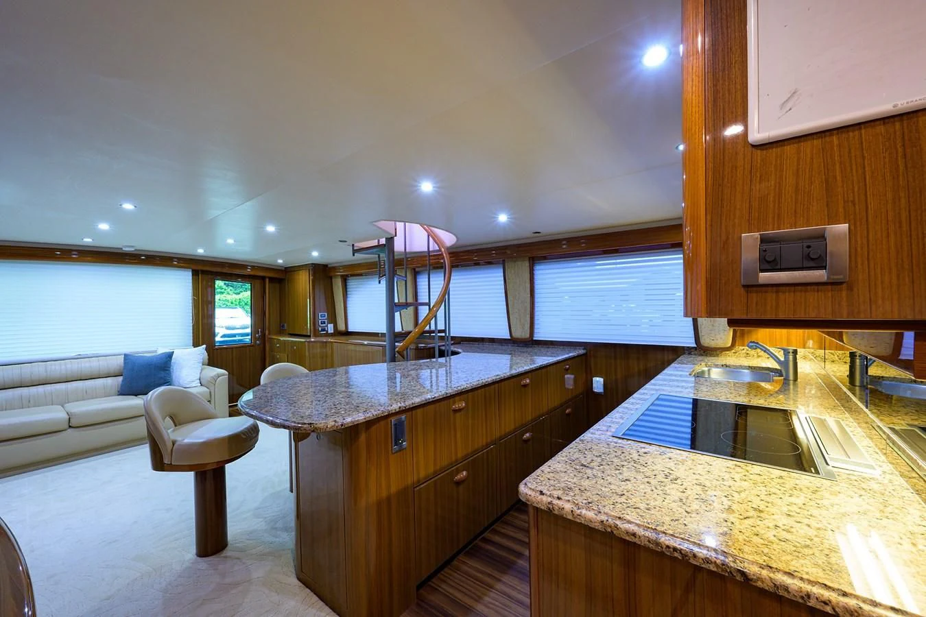 a kitchen with a bar and a couch aboard KNOT RACING Yacht for Sale