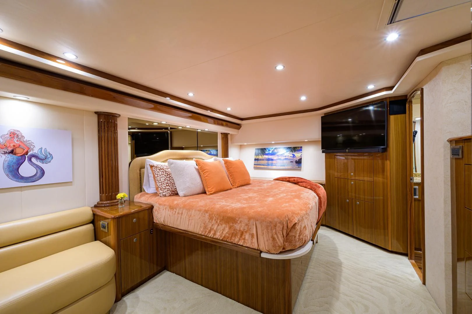 a bedroom with a bed and a television aboard KNOT RACING Yacht for Sale