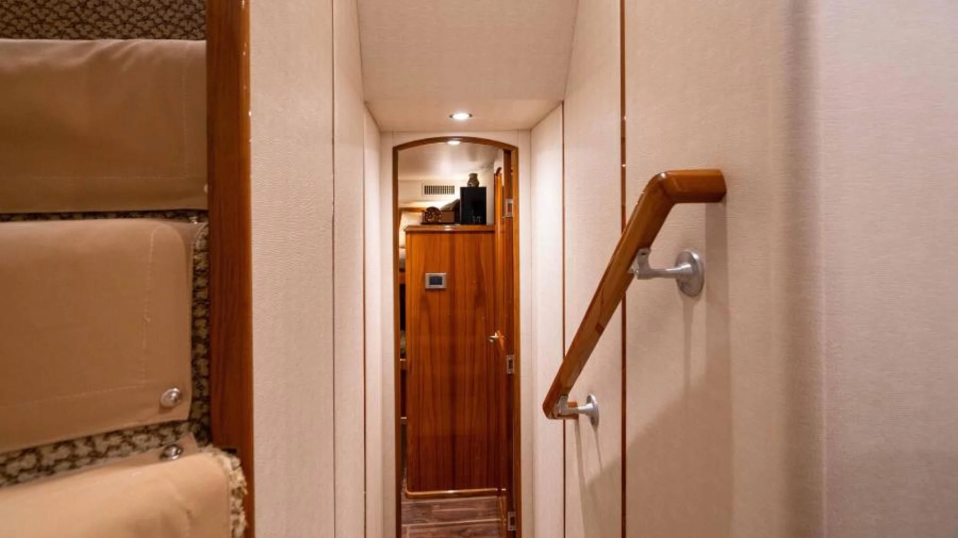 a bathroom with a wood door aboard NEVER TOO LATE Yacht for Charter