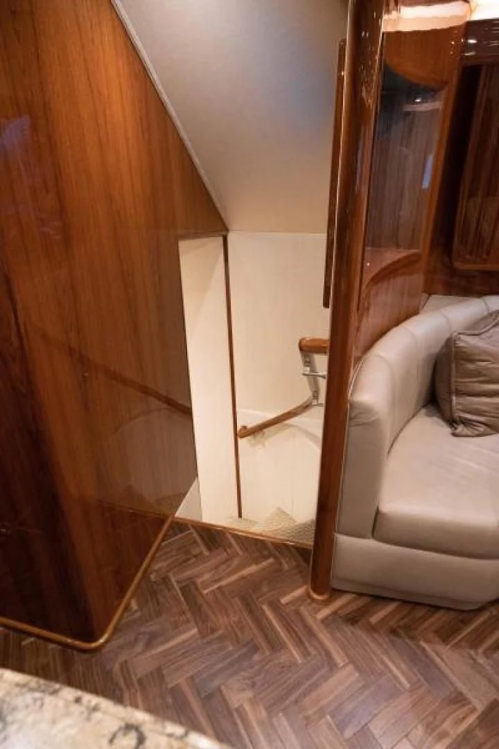 a room with a mirror and a couch aboard NEVER TOO LATE Yacht for Charter