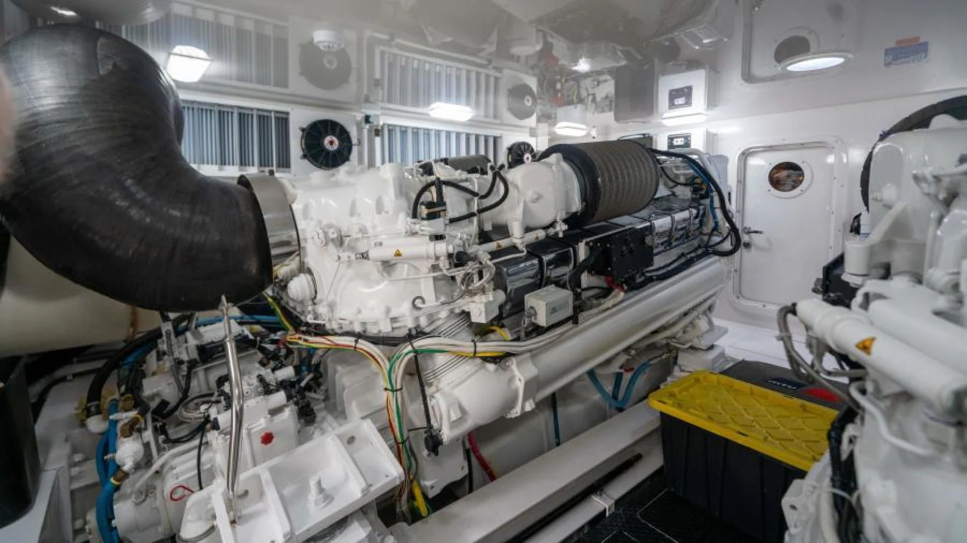 a large white machine with a large metal object on it aboard NEVER TOO LATE Yacht for Charter