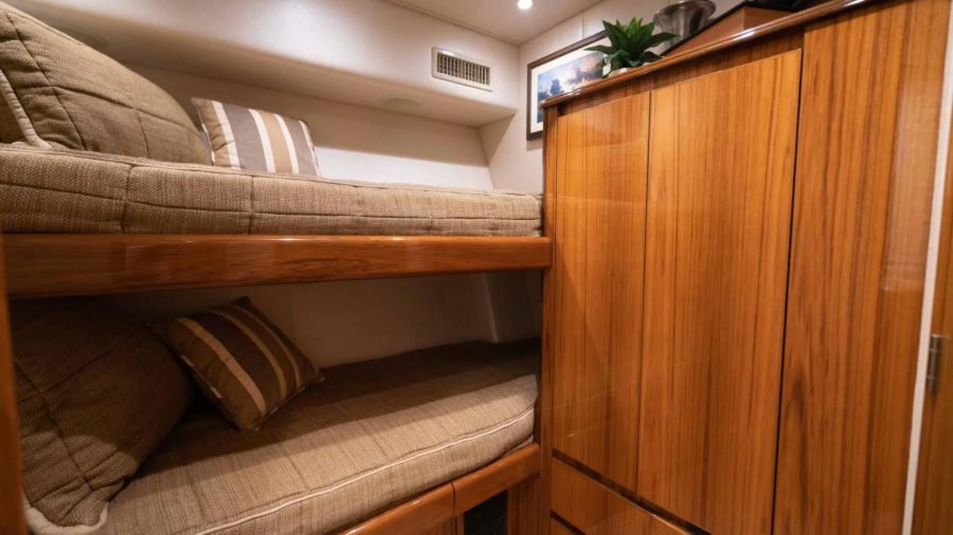 a couch with pillows aboard NEVER TOO LATE Yacht for Charter