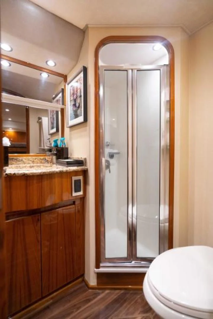 a bathroom with a glass shower aboard NEVER TOO LATE Yacht for Charter