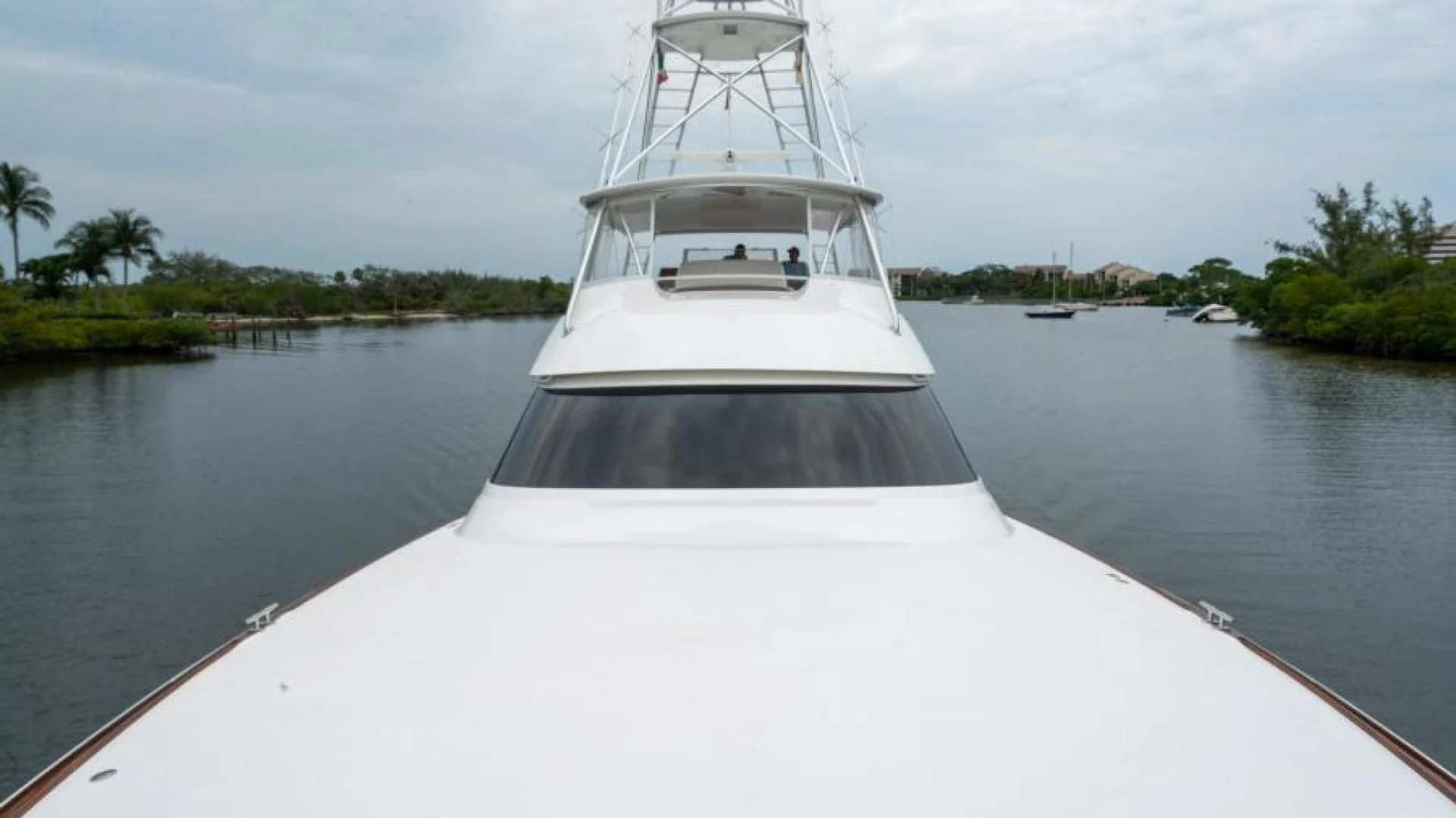 a white boat on water aboard NEVER TOO LATE Yacht for Charter