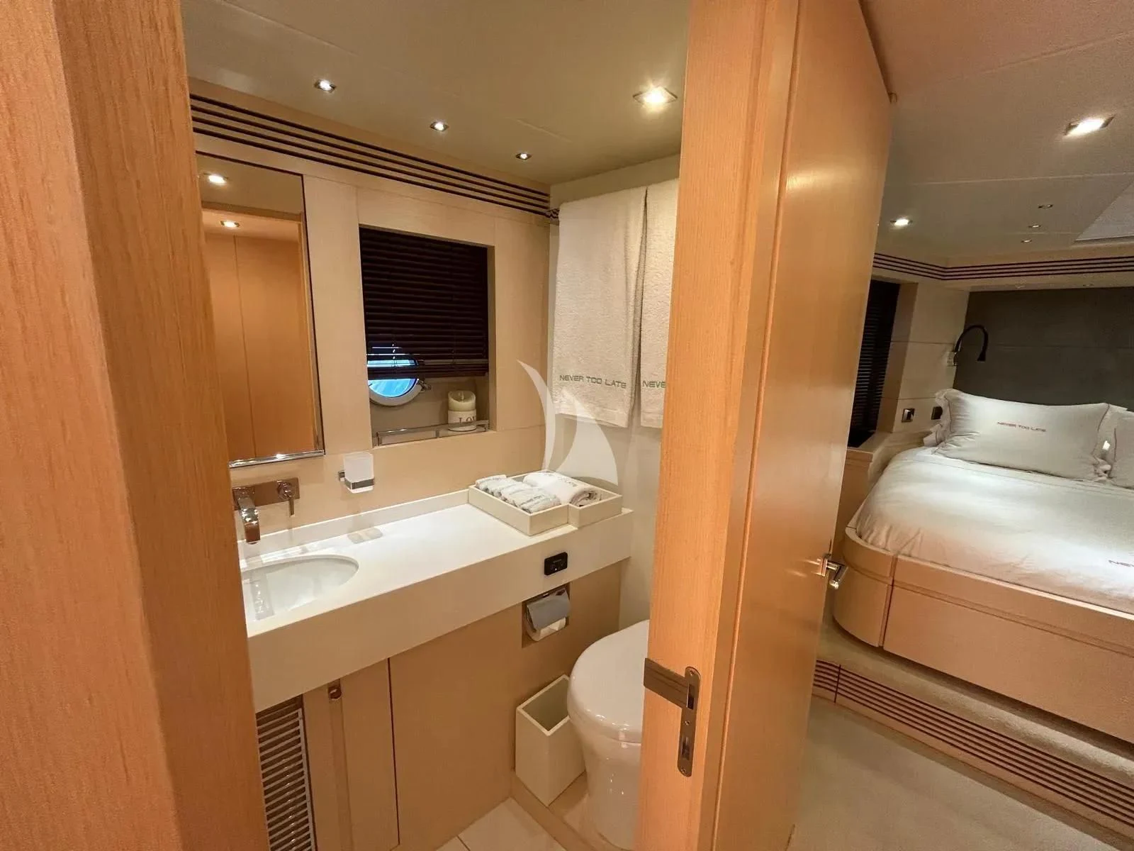 a bathroom with a sink and a bathtub aboard NEVER TOO LATE Yacht for Charter