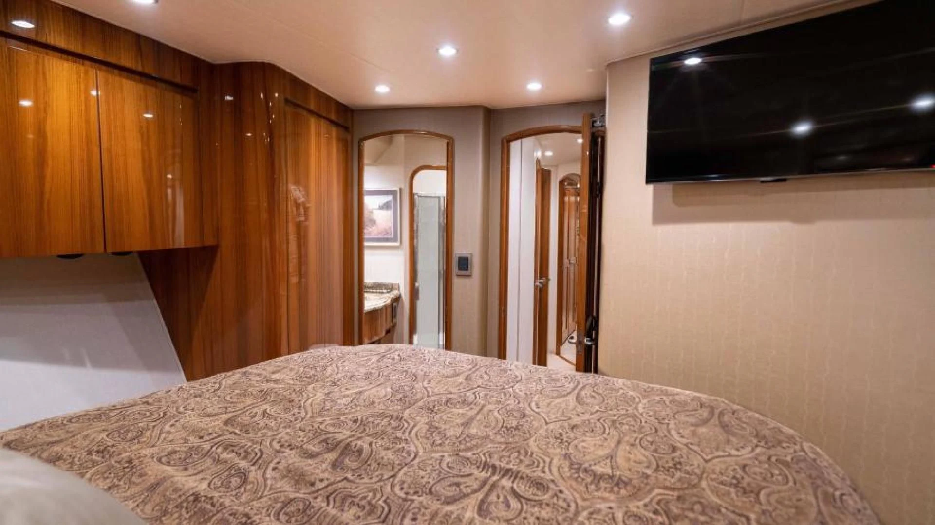 a large bed in a room aboard NEVER TOO LATE Yacht for Charter