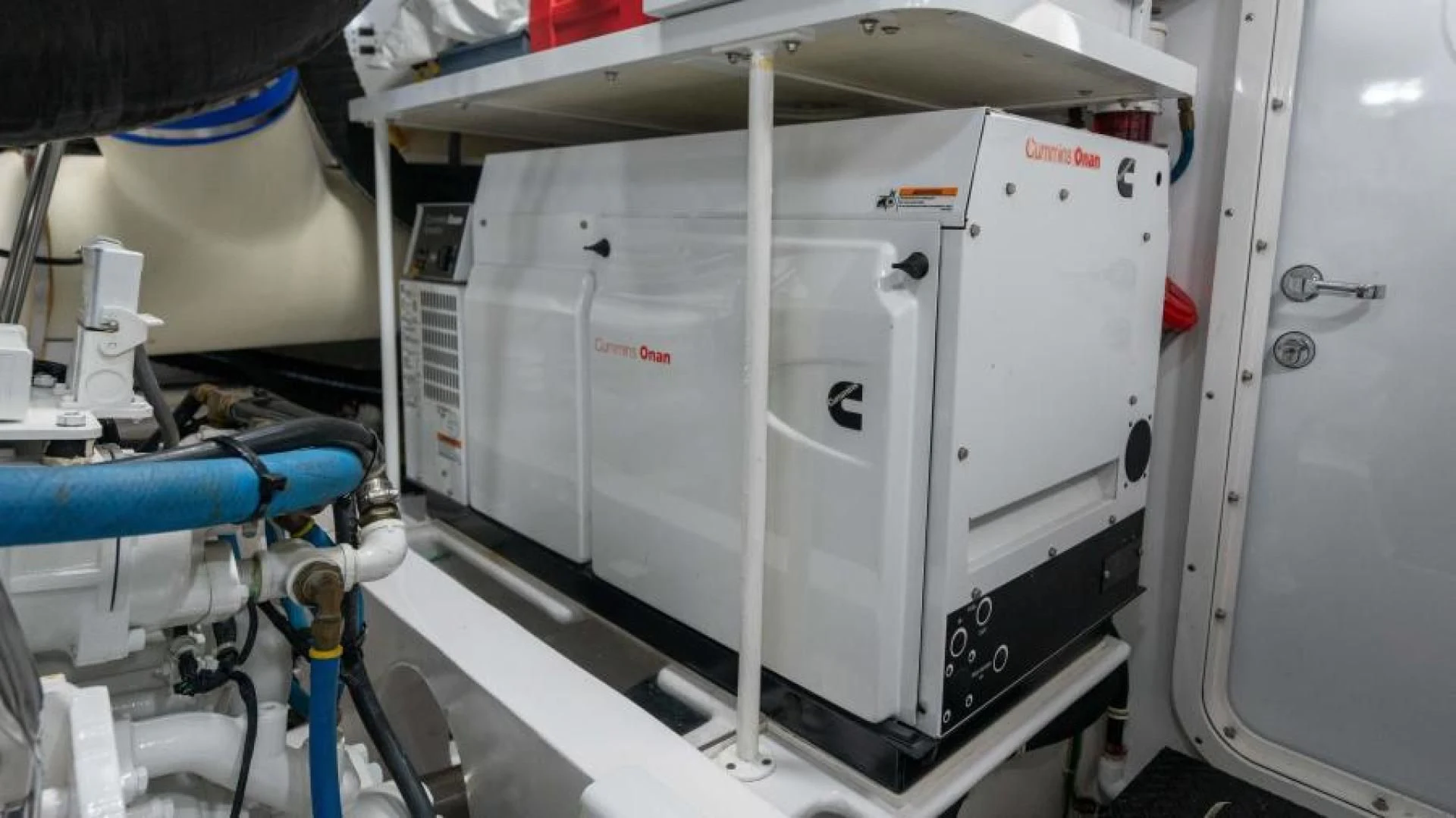 a machine with a large white object on the side aboard NEVER TOO LATE Yacht for Charter