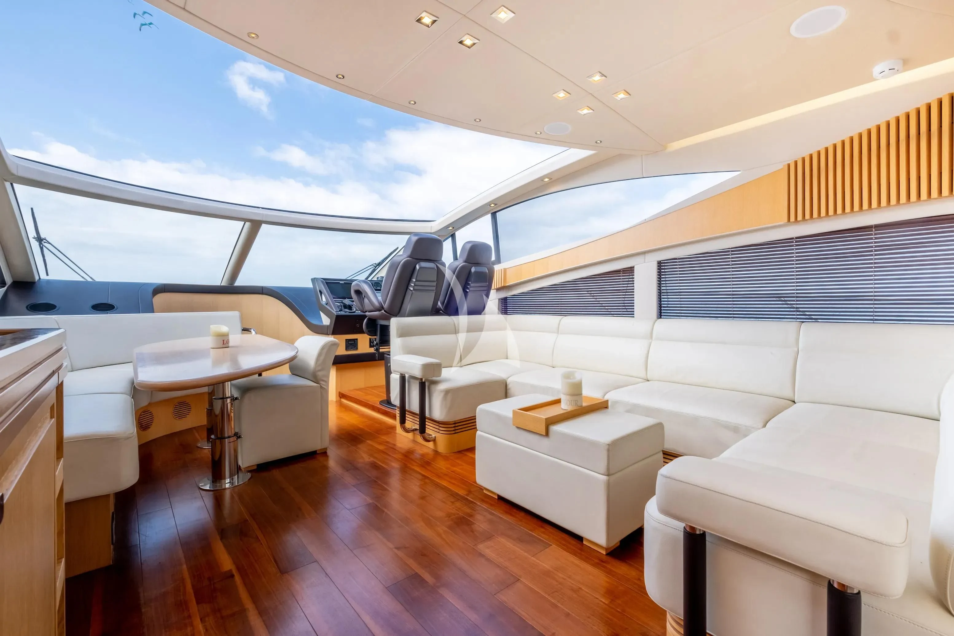 a room with a table and chairs aboard NEVER TOO LATE Yacht for Charter