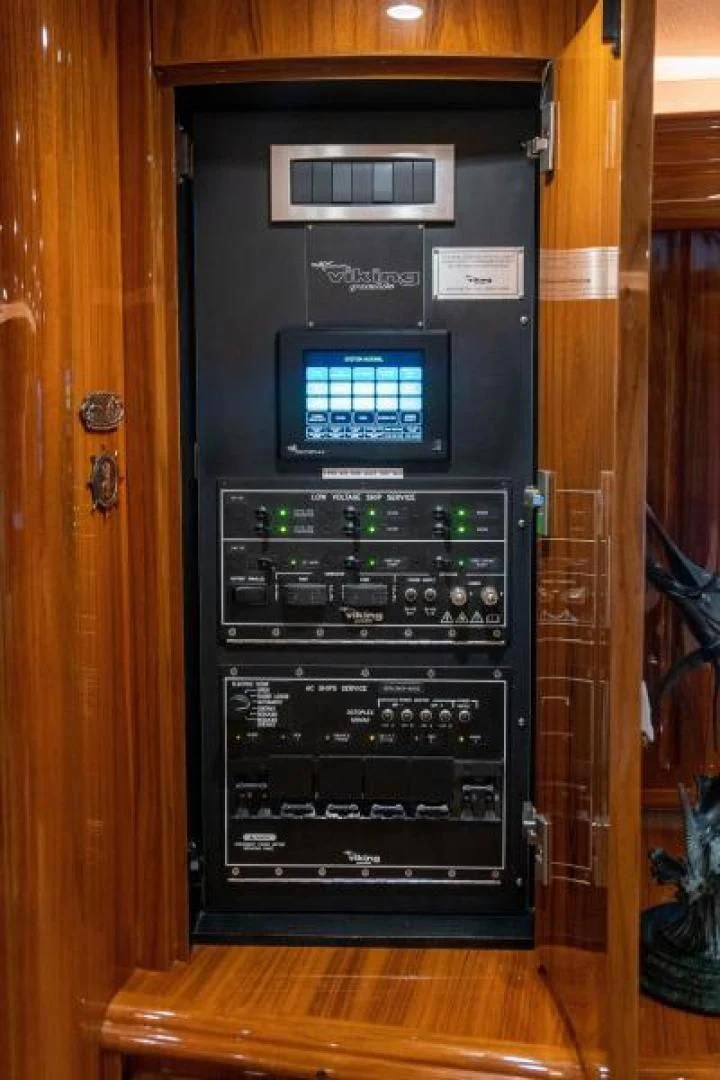 a black computer tower aboard NEVER TOO LATE Yacht for Charter
