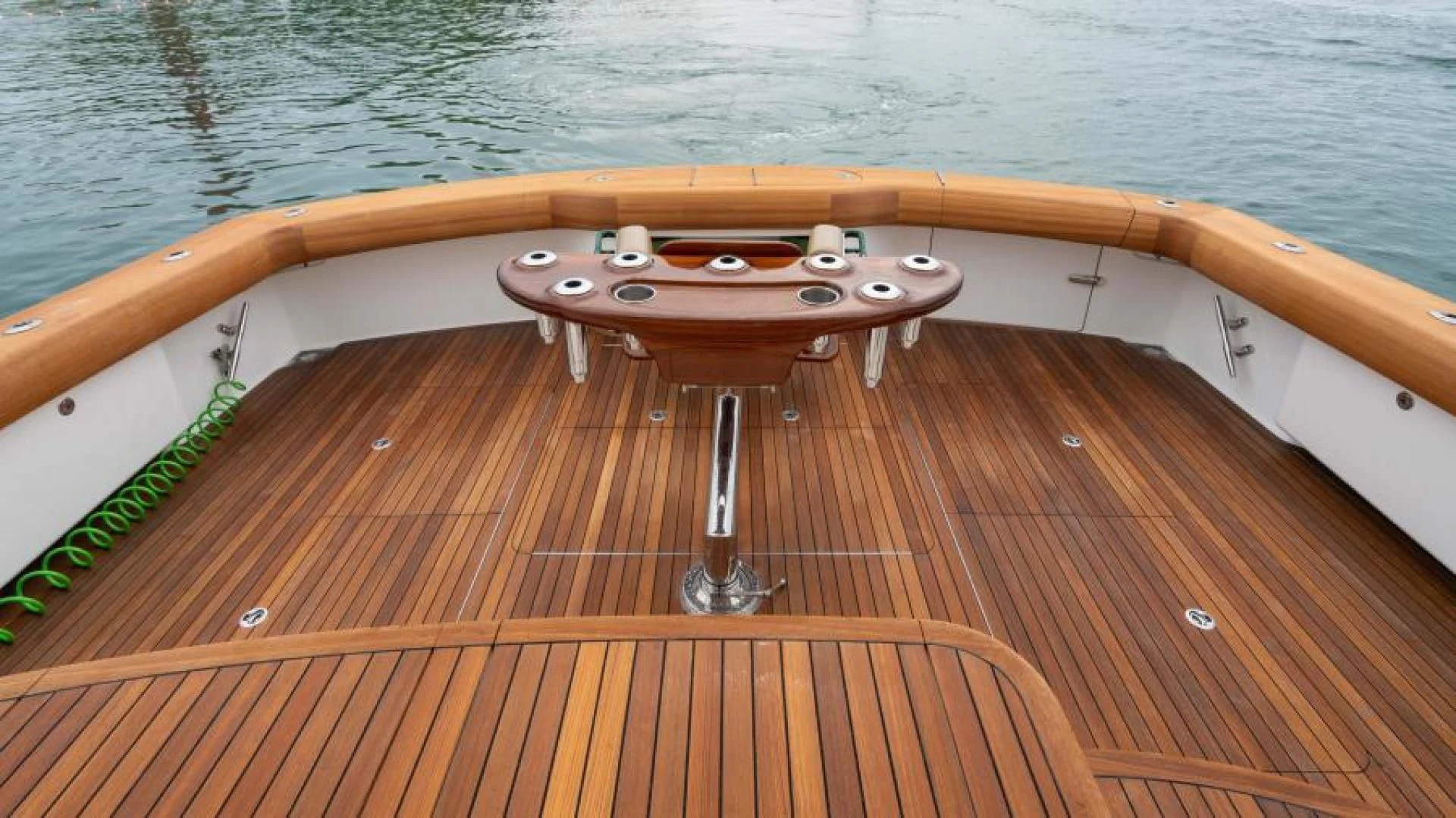 a wooden boat on the water aboard NEVER TOO LATE Yacht for Charter