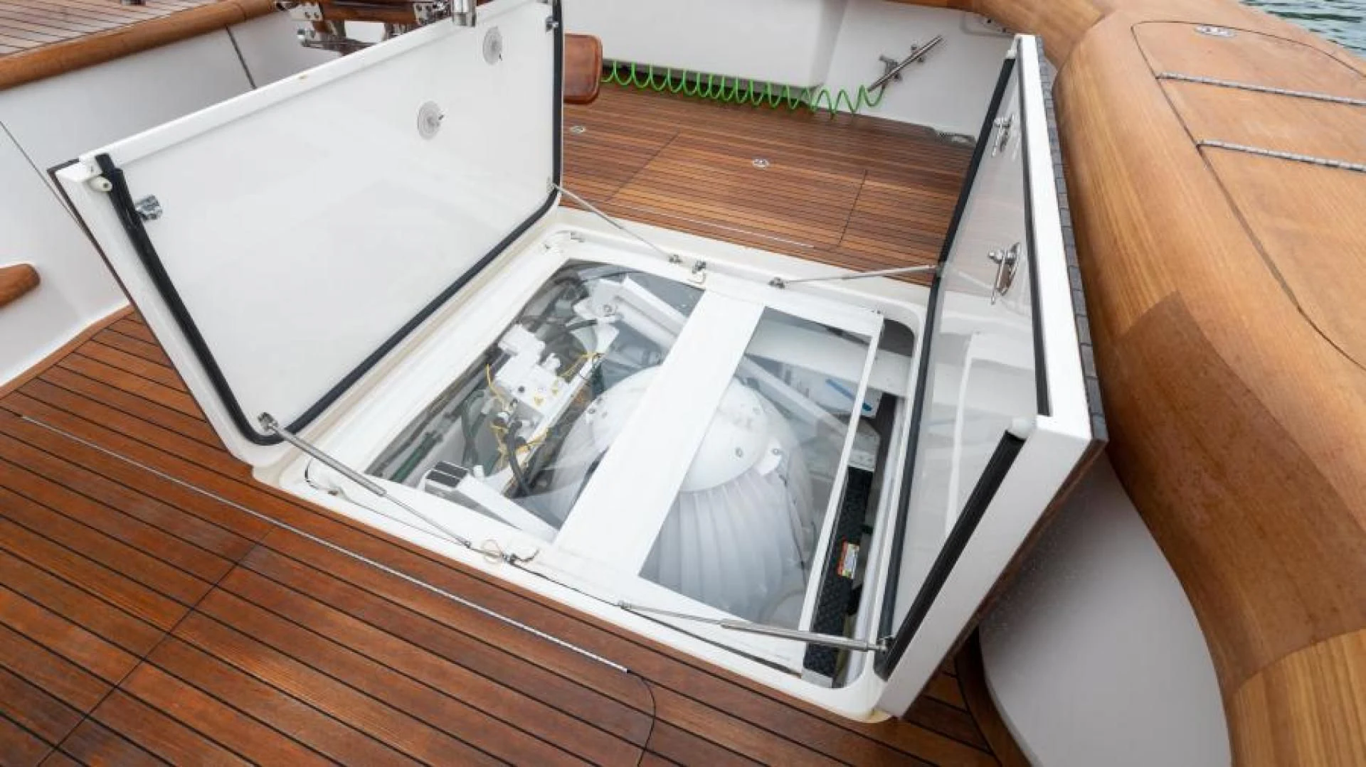 a white rectangular object with a black object on it aboard NEVER TOO LATE Yacht for Charter