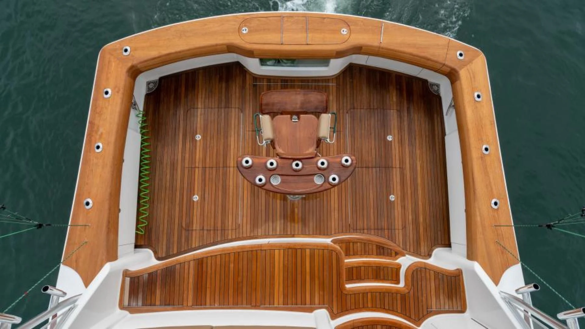 a wooden object with a wooden handle aboard NEVER TOO LATE Yacht for Charter