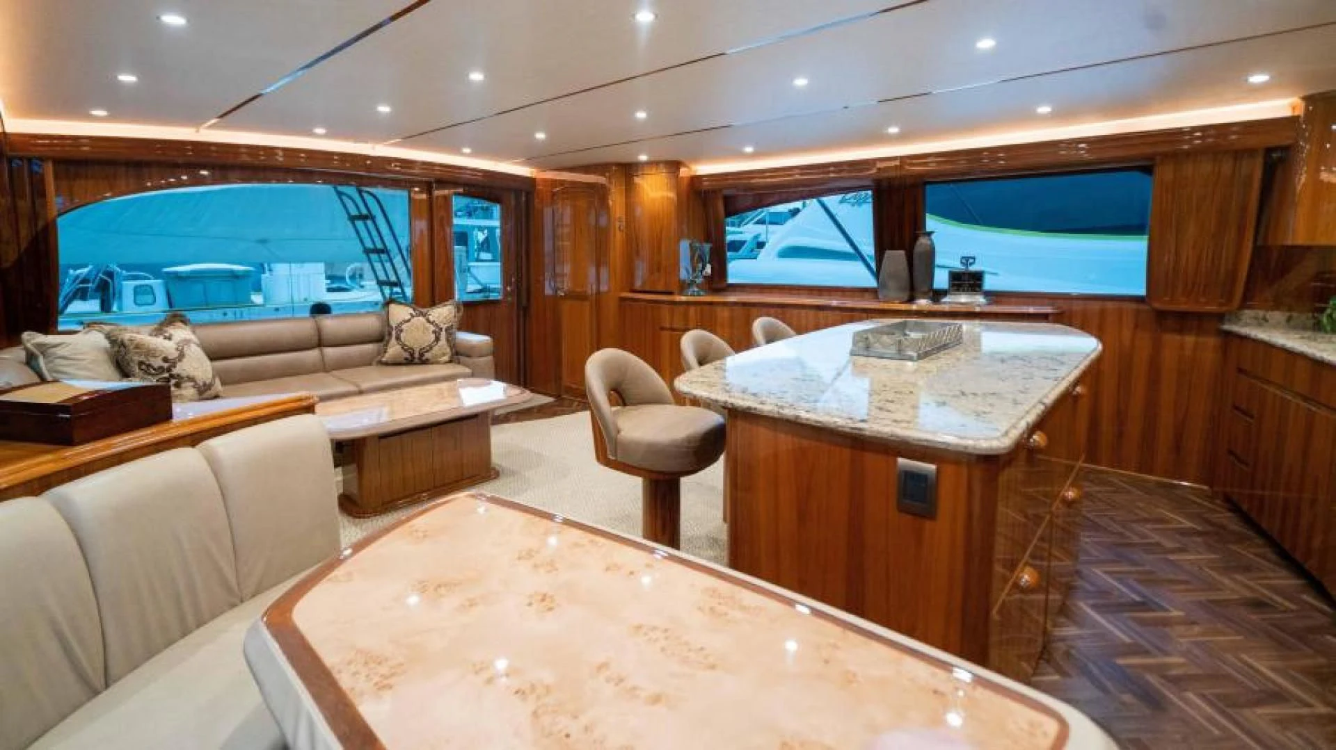 a living room with a couch and a table aboard NEVER TOO LATE Yacht for Charter