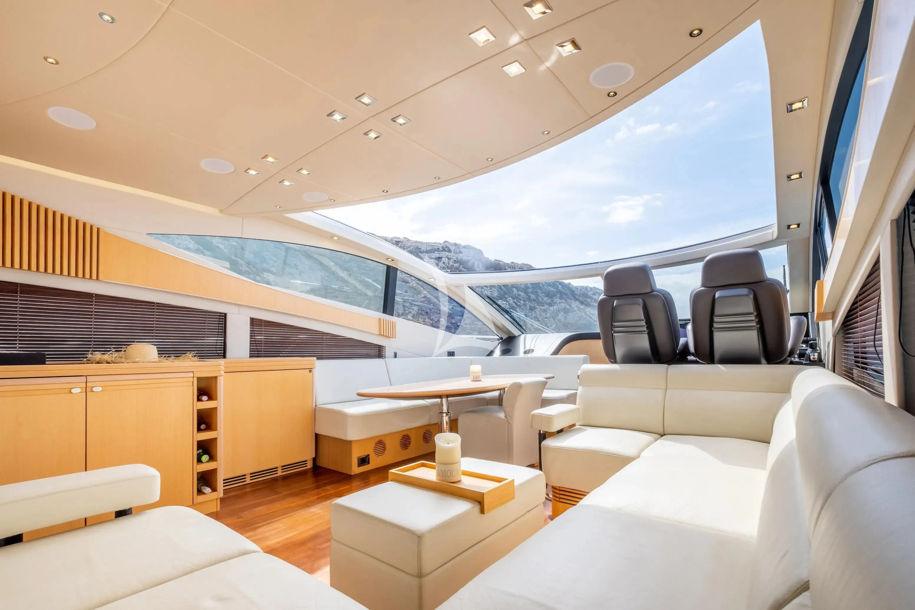 a room with a large window aboard NEVER TOO LATE Yacht for Charter