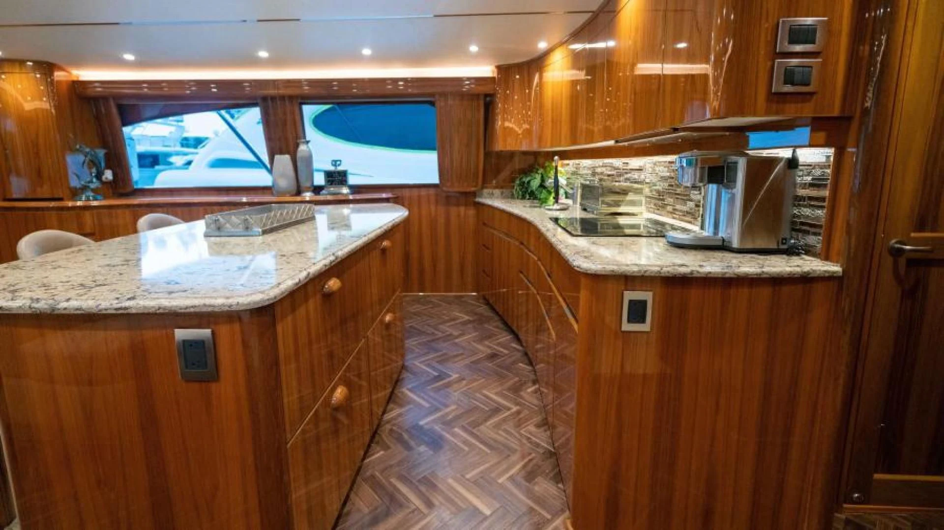 a kitchen with a countertop sink and cabinets aboard NEVER TOO LATE Yacht for Charter