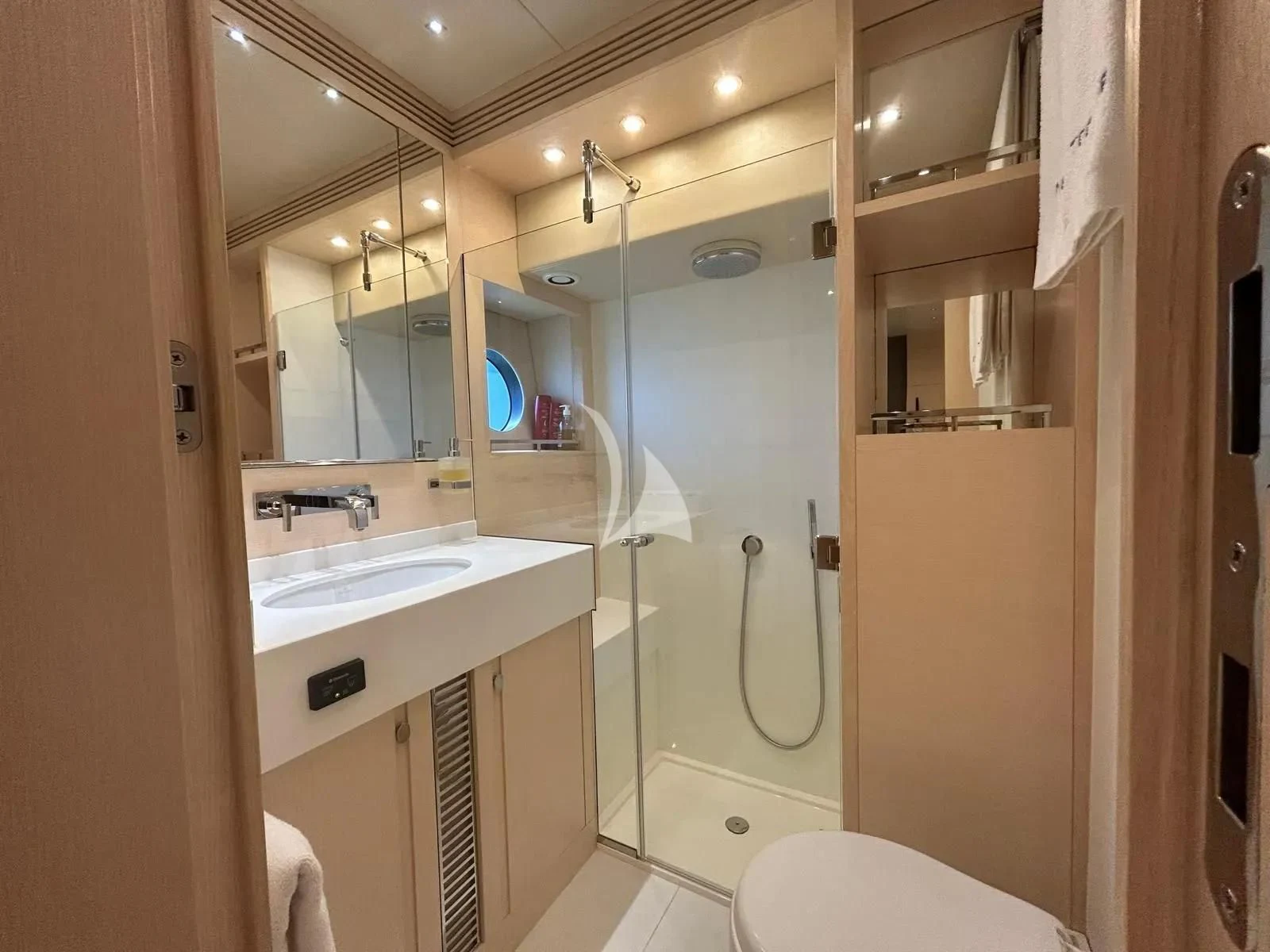 a bathroom with a large mirror aboard NEVER TOO LATE Yacht for Charter