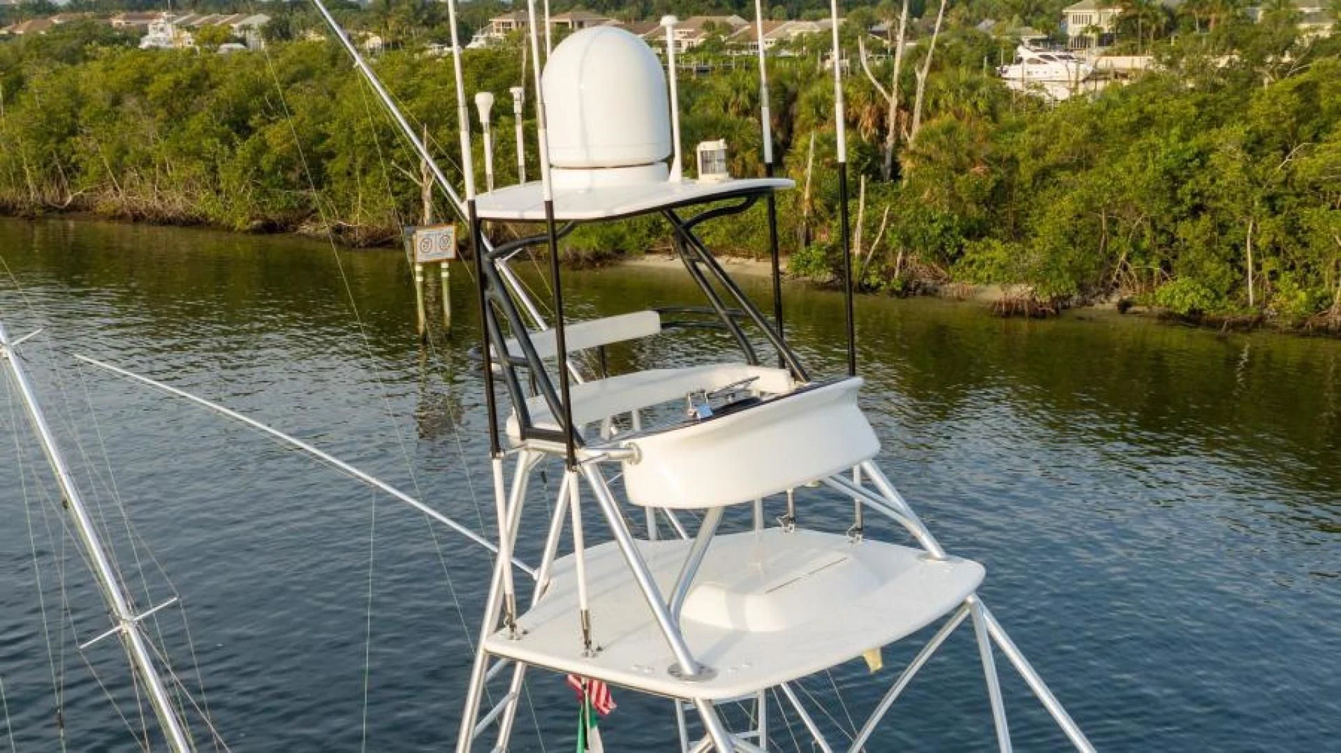 a white boat on the water aboard NEVER TOO LATE Yacht for Charter