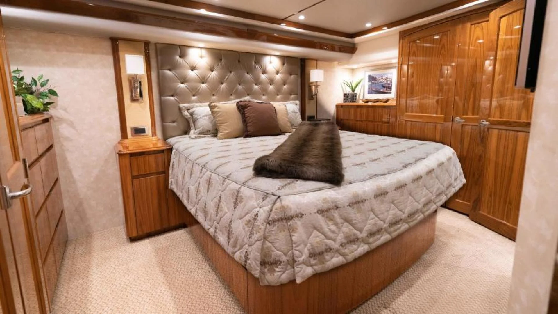 a bed in a room aboard NEVER TOO LATE Yacht for Charter