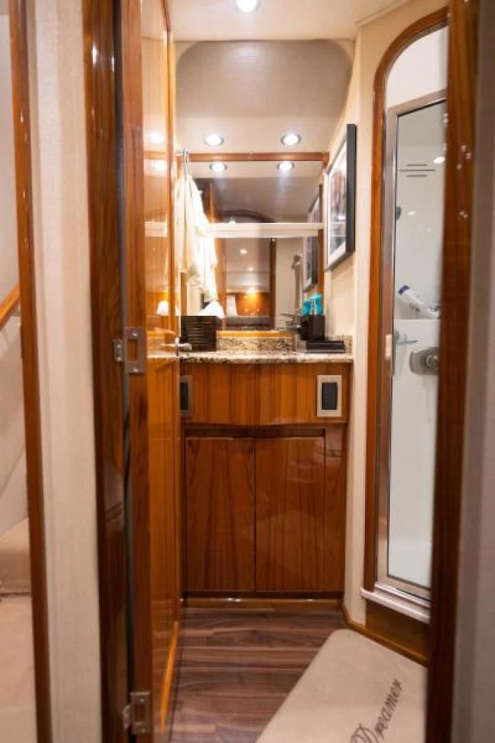 a bathroom with a sink and cabinets aboard NEVER TOO LATE Yacht for Charter