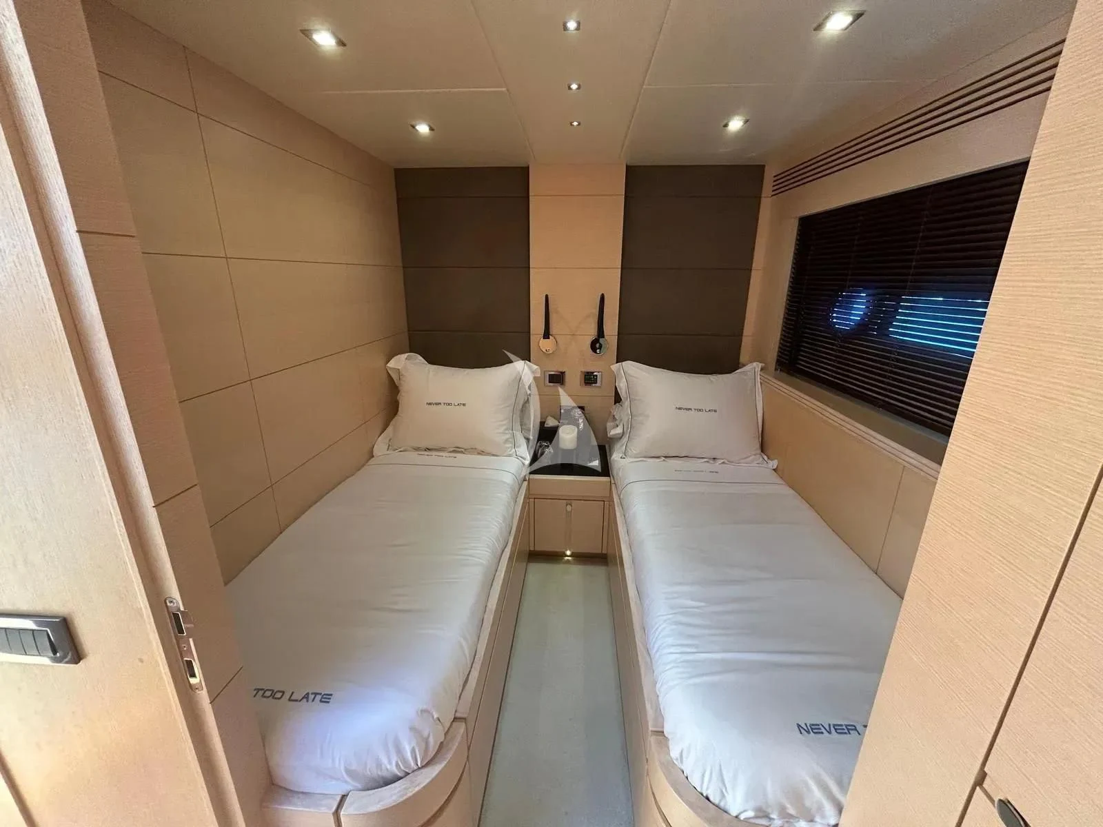 a room with two beds aboard NEVER TOO LATE Yacht for Charter
