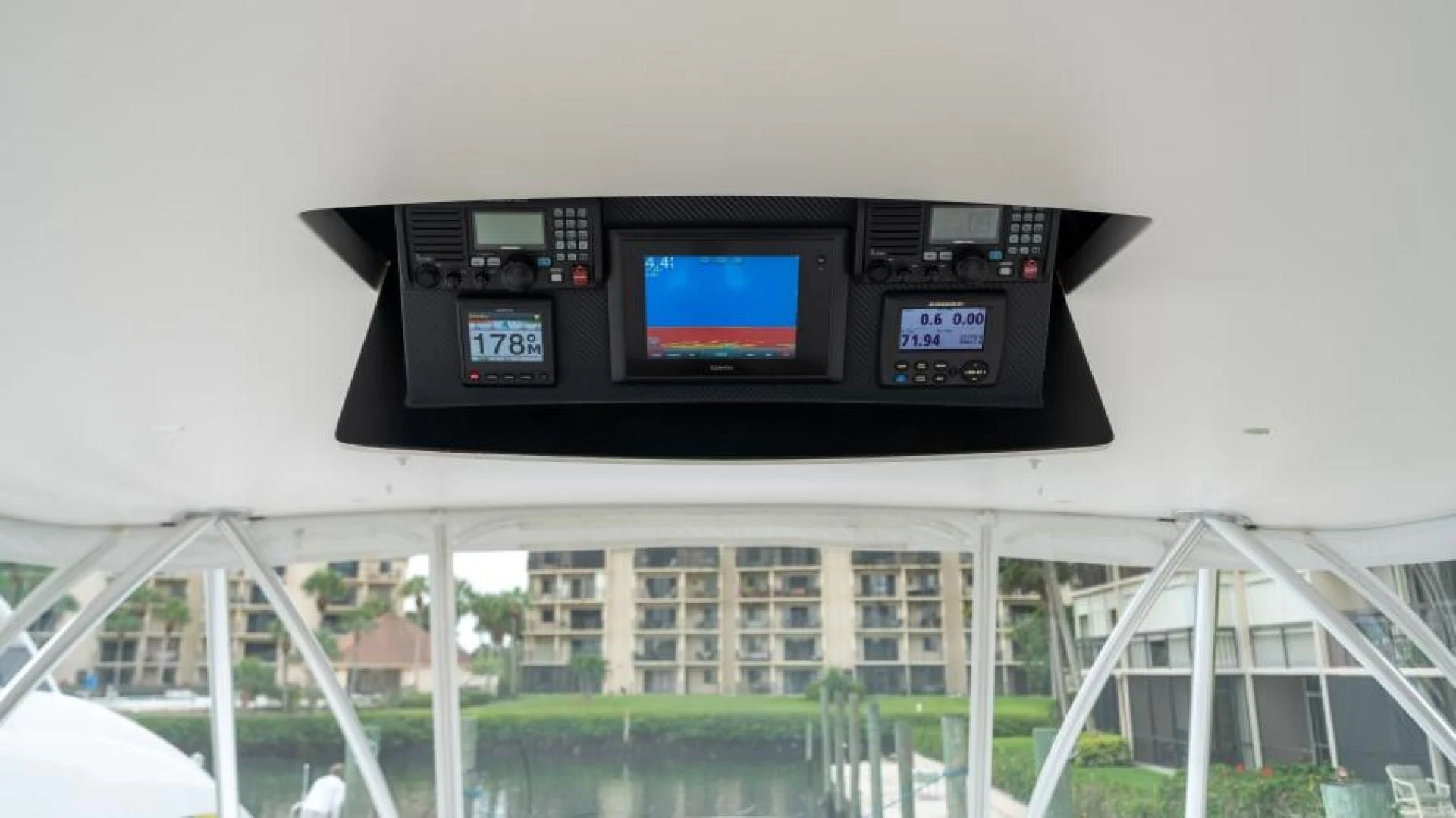 a black rectangular object with a screen aboard NEVER TOO LATE Yacht for Charter