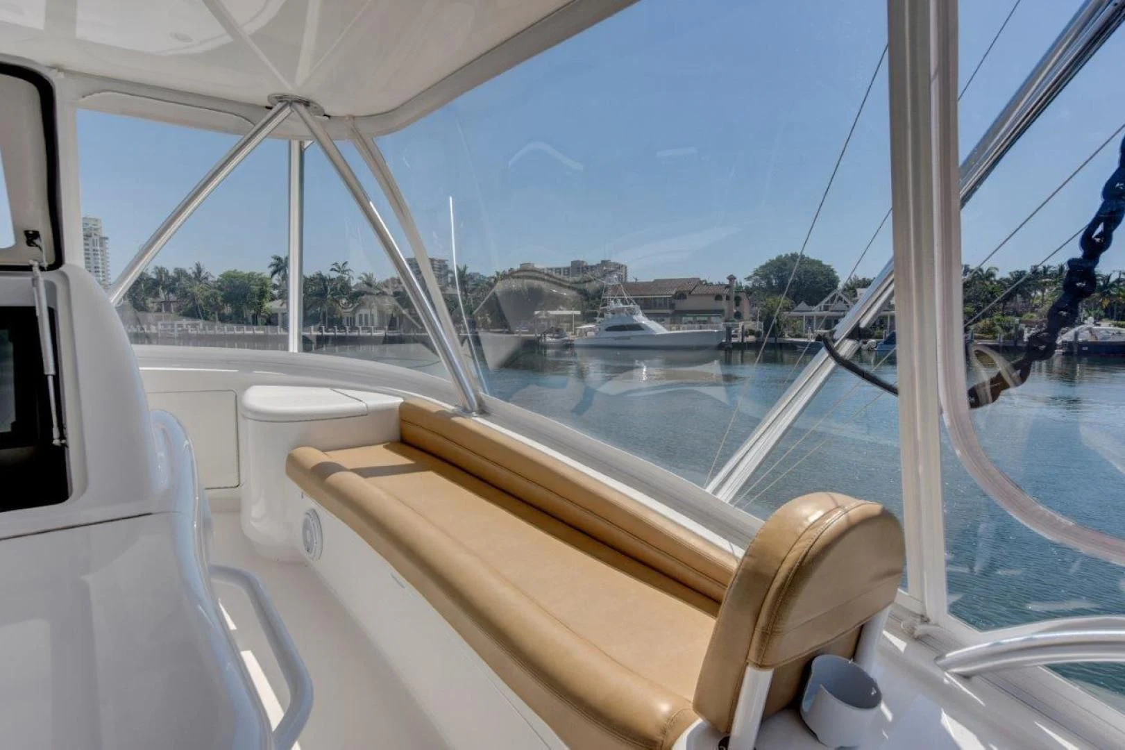 a boat with a view of the water and boats in the background aboard KICK'N Yacht for Sale
