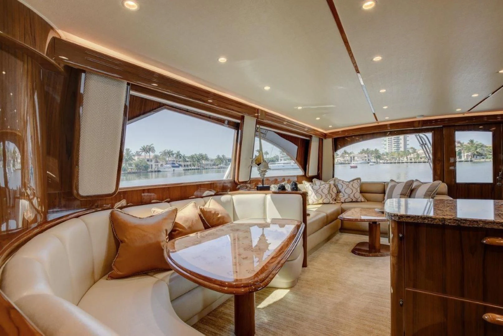 a living room with a couch and a table aboard KICK'N Yacht for Sale