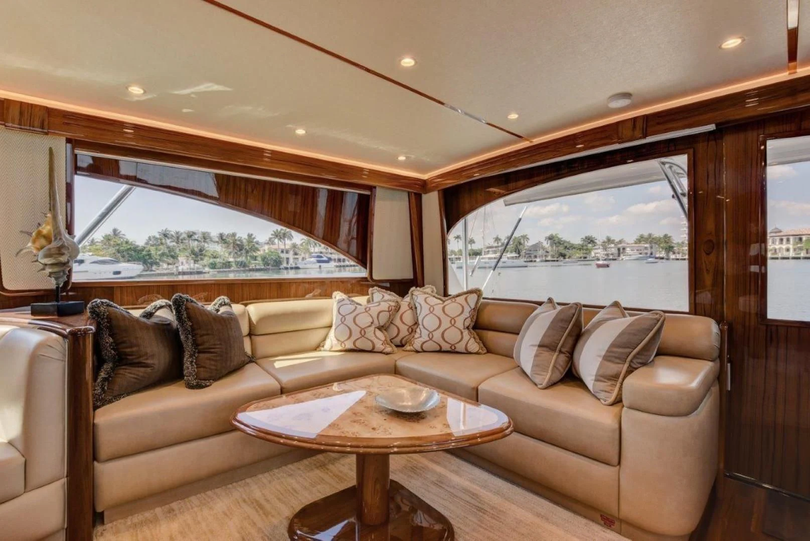 a living room with a couch and a table aboard KICK'N Yacht for Sale