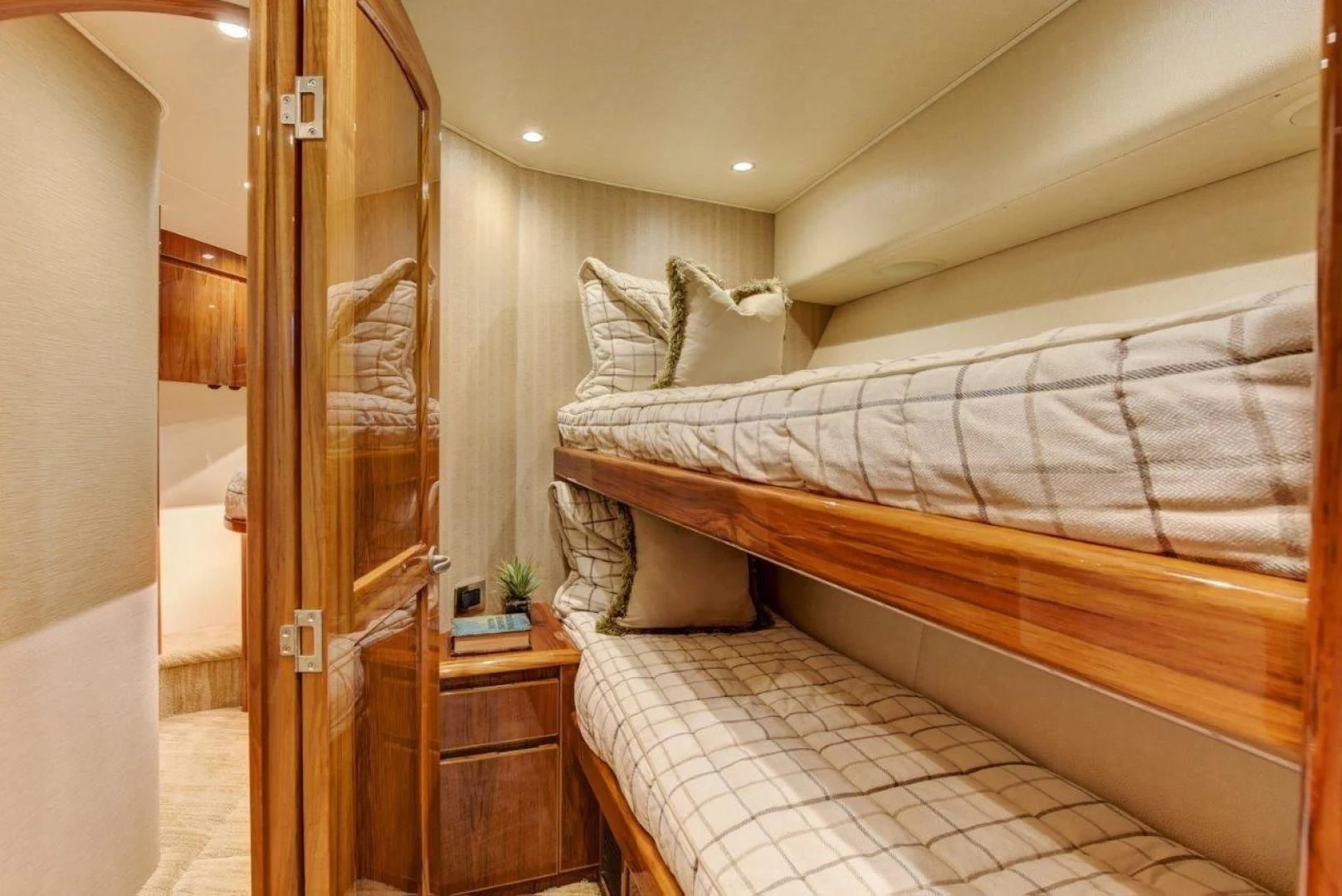 a bedroom with two beds aboard KICK'N Yacht for Sale