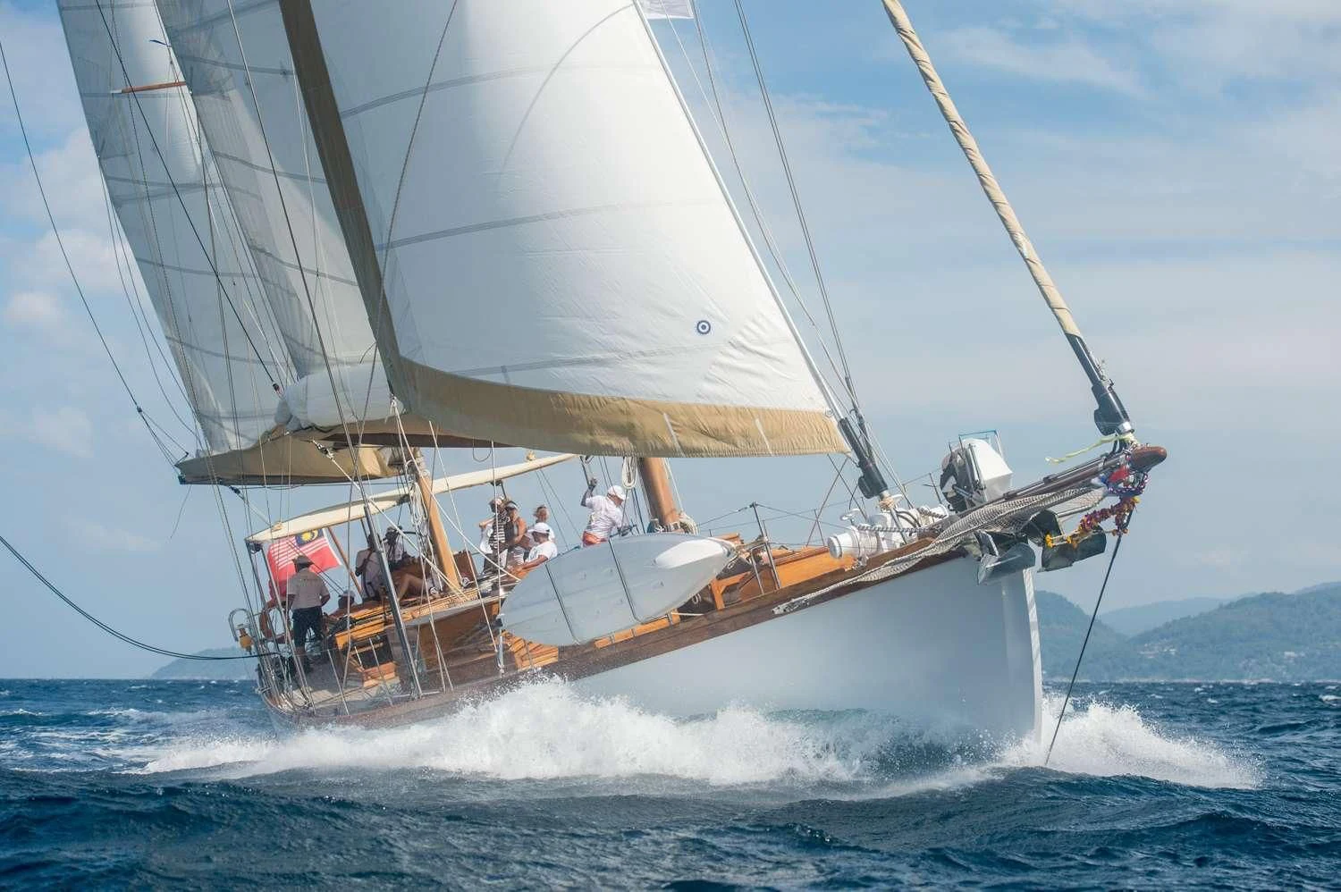 a sailboat with people on it aboard AVENTURE Yacht for Sale