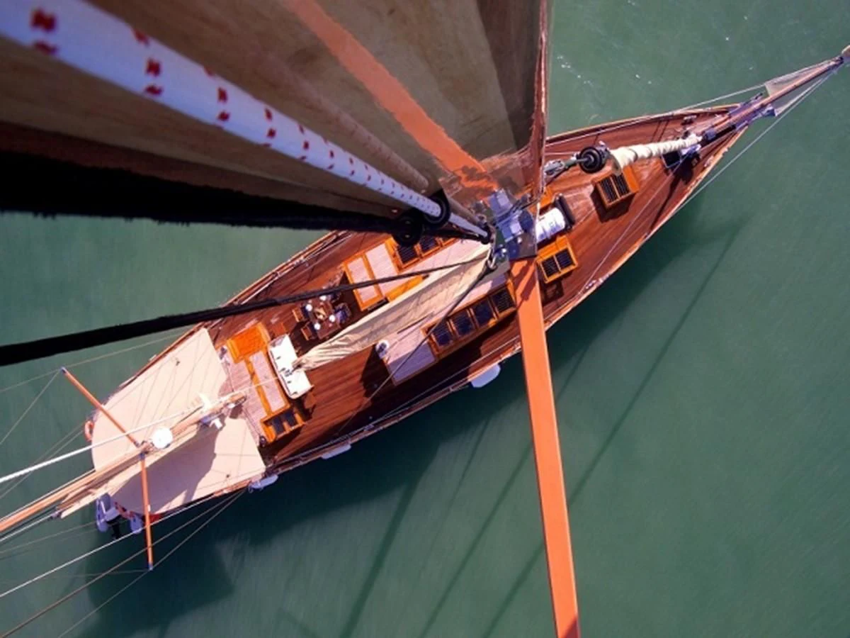 a plane flying over a field aboard AVENTURE Yacht for Sale