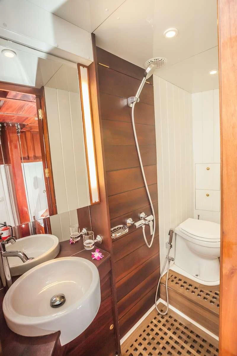 a bathroom with a sink and a toilet aboard AVENTURE Yacht for Sale