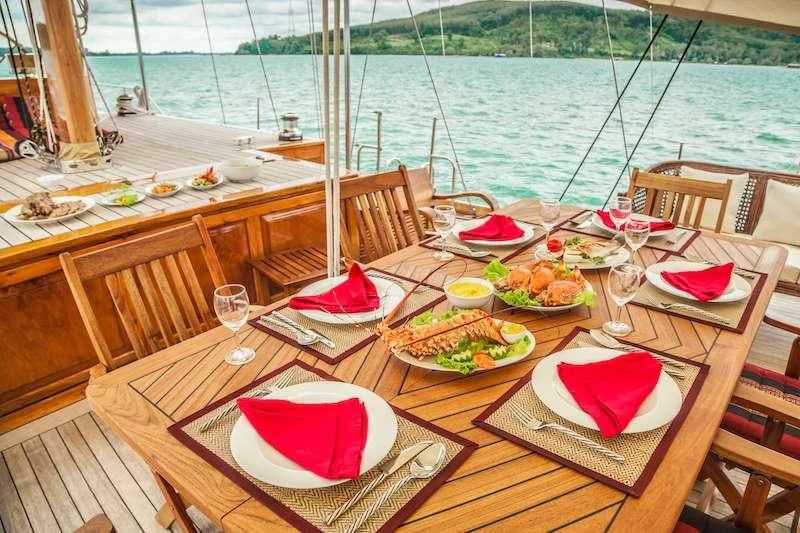 a table with food on it aboard AVENTURE Yacht for Sale