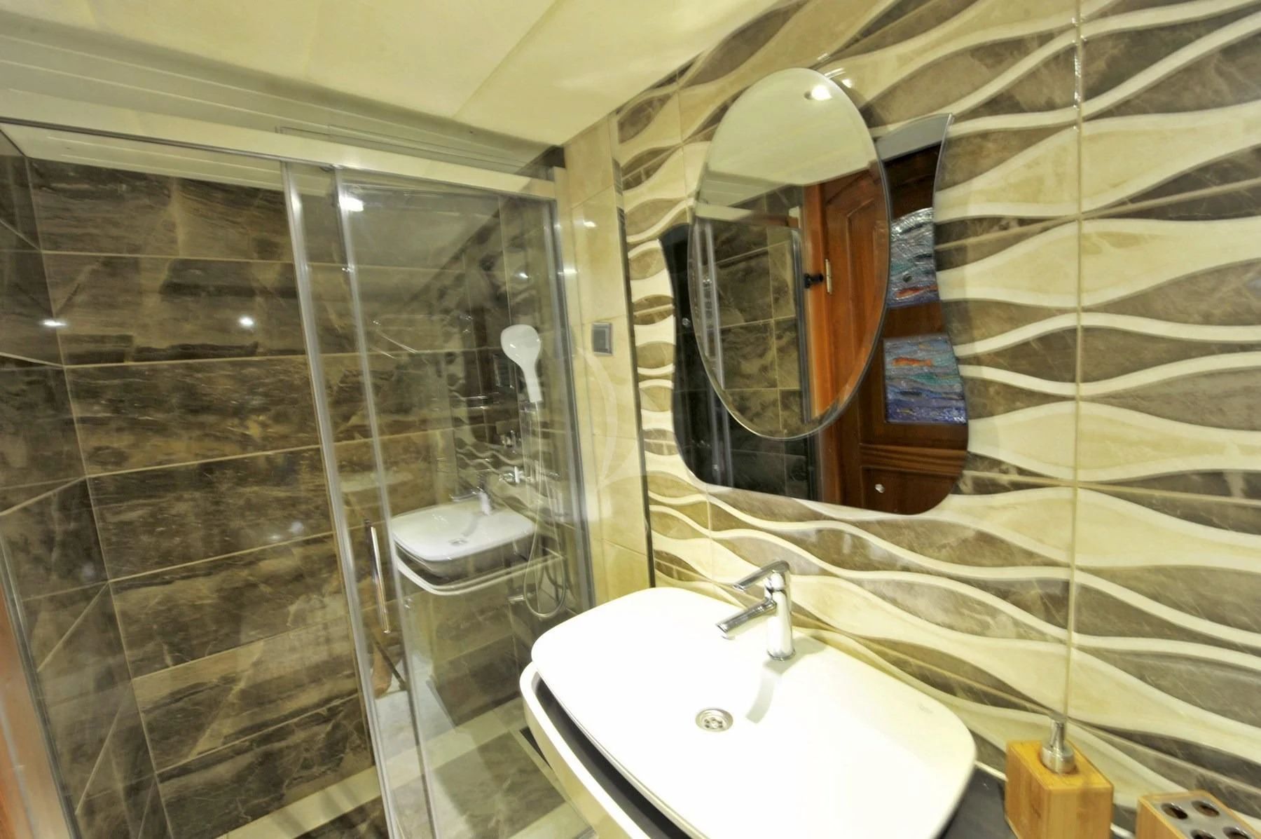 a bathroom with a glass shower aboard BERRAK SU Yacht for Sale