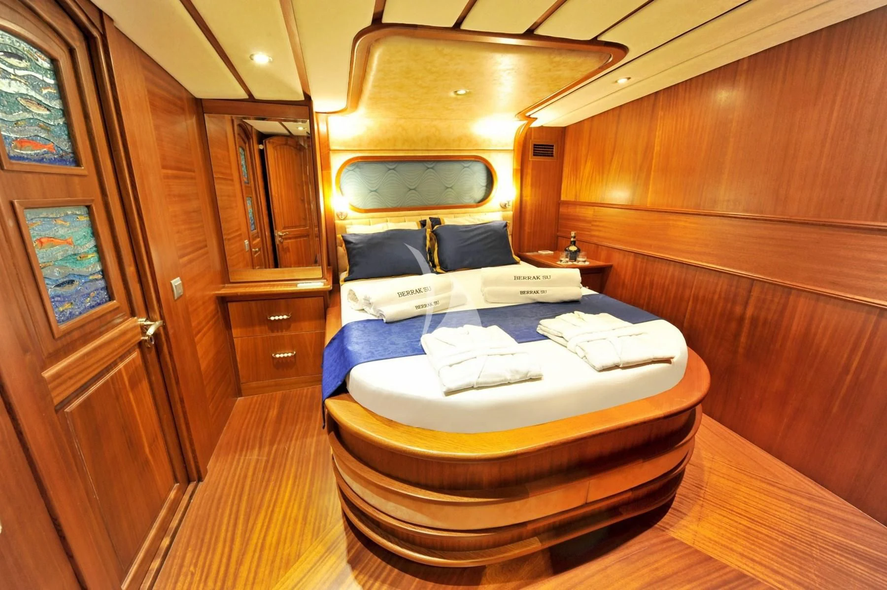 a room with a bed and a dresser aboard BERRAK SU Yacht for Sale