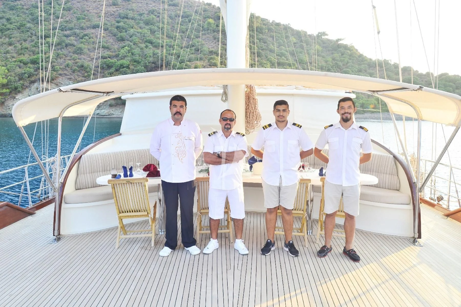 a group of men posing for a photo aboard BERRAK SU Yacht for Sale