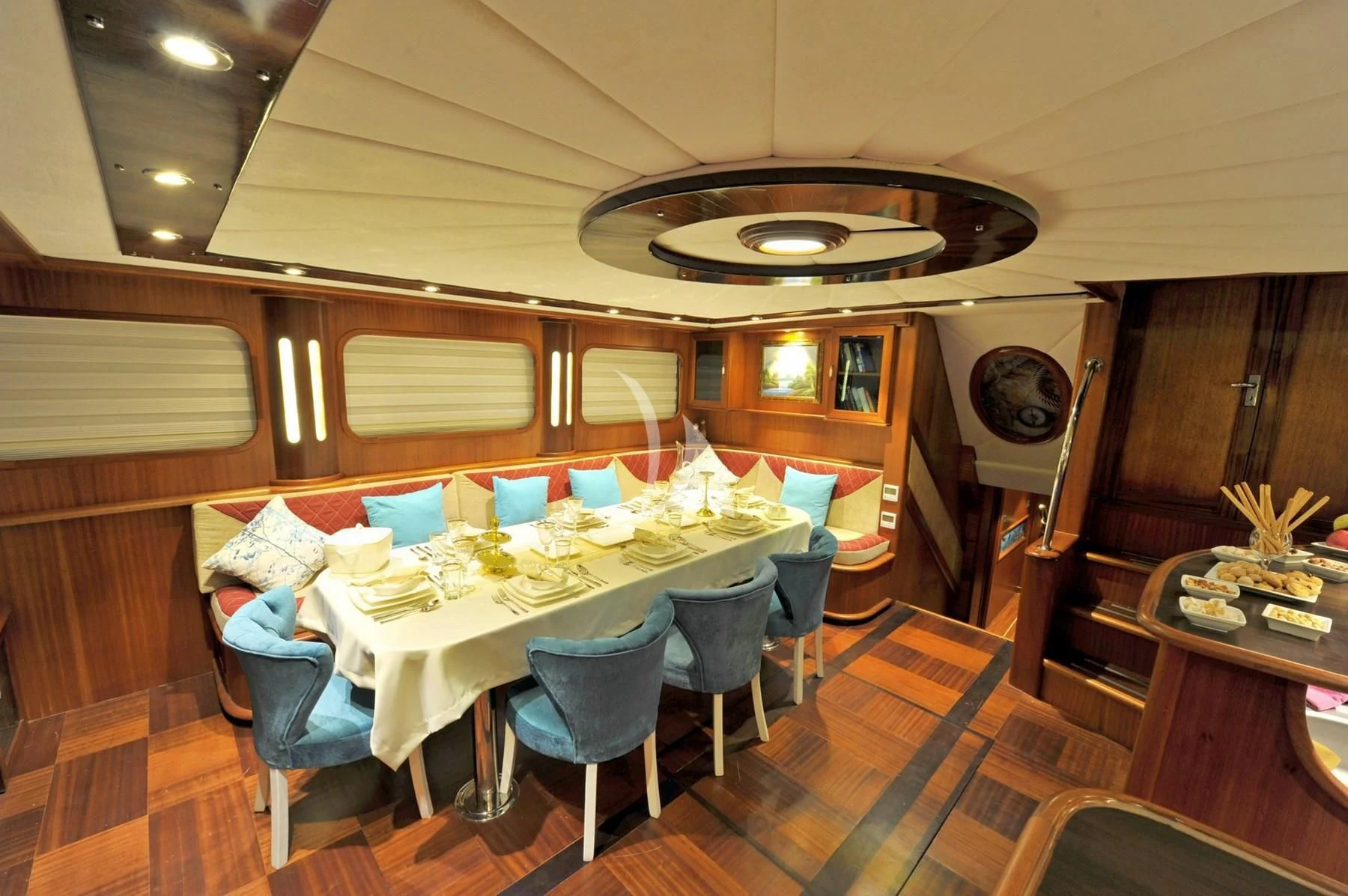 a room with a table and chairs aboard BERRAK SU Yacht for Sale