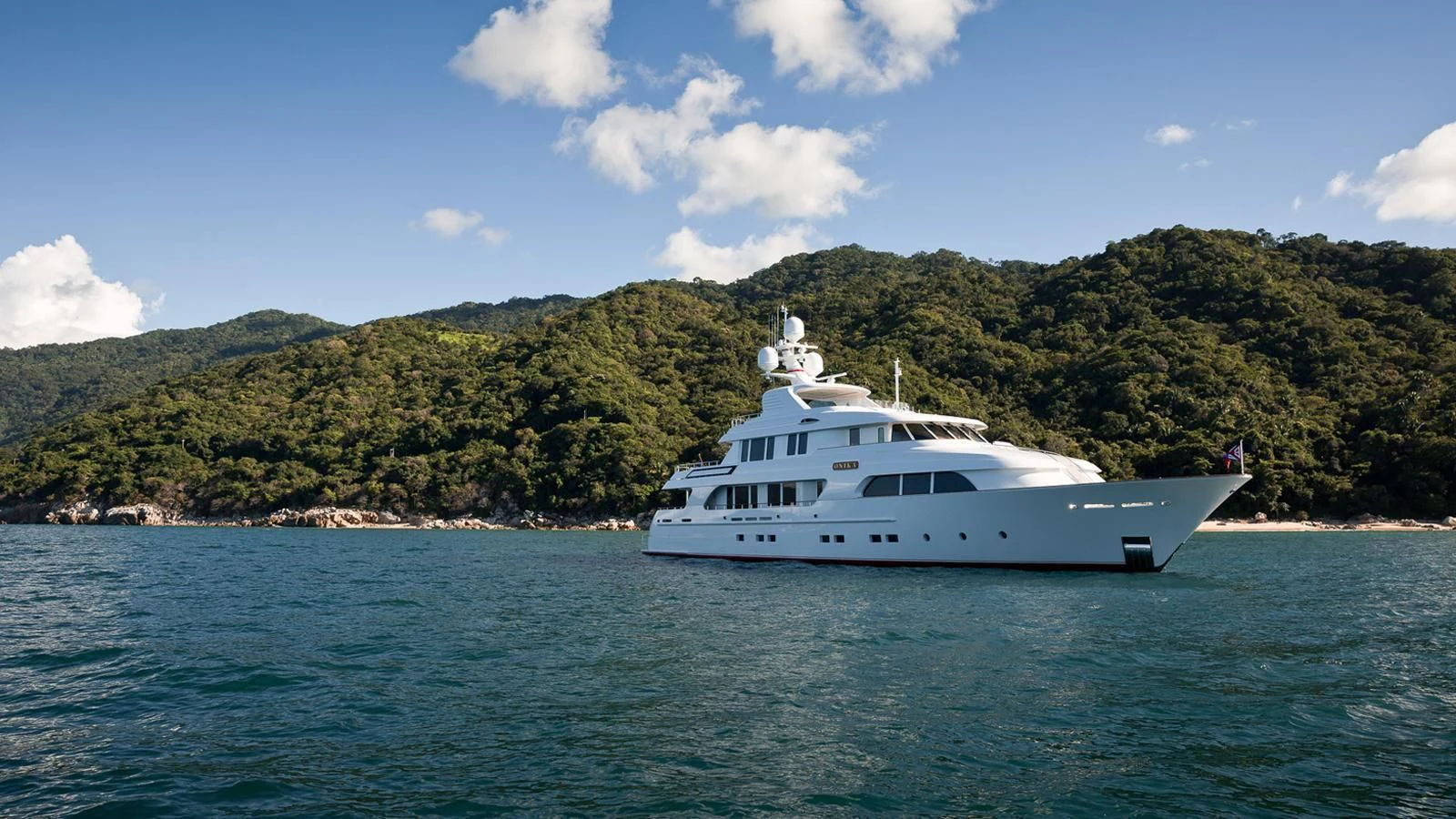 a white yacht on the water aboard ONIKA Yacht for Sale