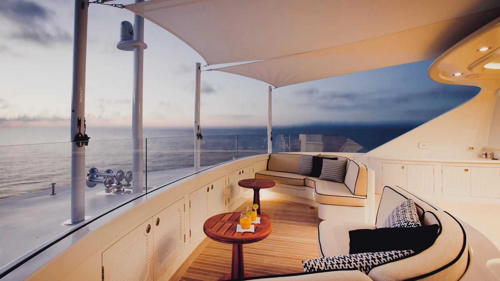 a room with a table and a couch aboard ONIKA Yacht for Sale
