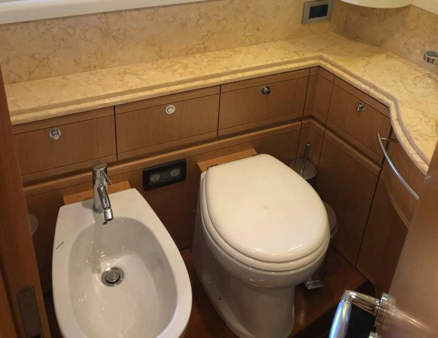a bathroom with a toilet and sink aboard MAR AZUL Yacht for Sale