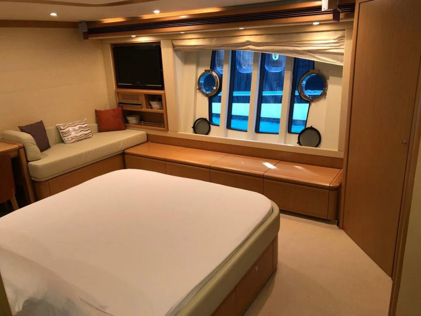 a room with a bed and a television aboard MAR AZUL Yacht for Sale